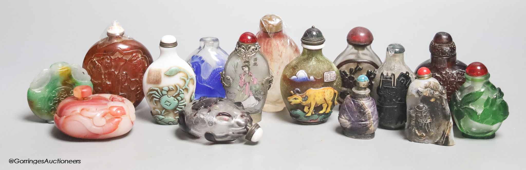 Fifteen Chinese glass overlay snuff bottles